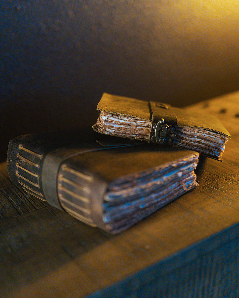 Handcrafted leather pirate journals and logs in Gaspar's Quarters at Gaspar's Luxury Estate, Tampa.
