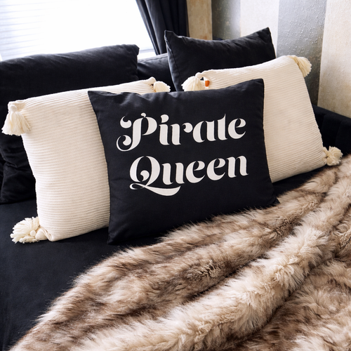 Pirate Queen pillow and faux fur throw in the Calypso Suite at Gaspar's Luxury Estate, Tampa.
