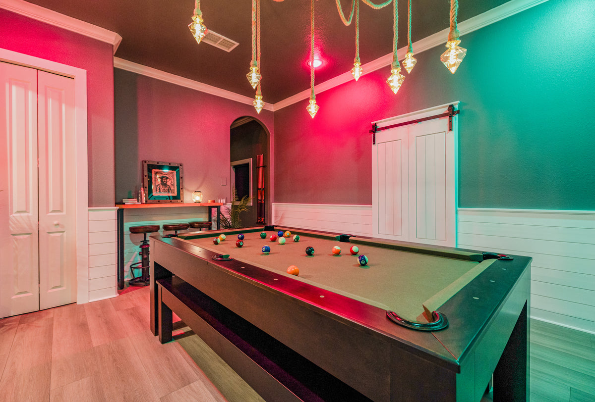 Luxury South Tampa Airbnb game room featuring a convertible billiards table and customizable LIFX smart lighting.